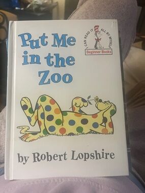 Dr. Scholl's White Cover with Multicolor Spotted Reptile Illustration